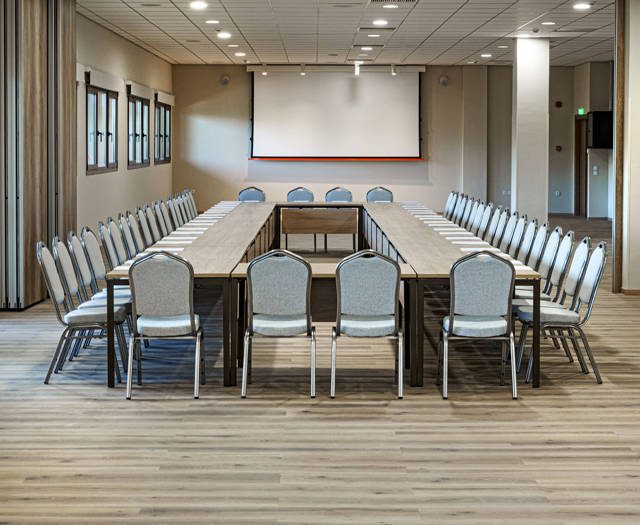 Ilis Congress Center Peloponnese Greece small conference room with squared table and a projector